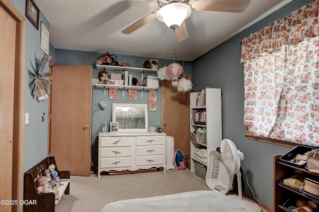 1501 Ryan Rd, Joplin, MO 64801 - carpeted bedroom with a ceiling fan and a textured ceiling