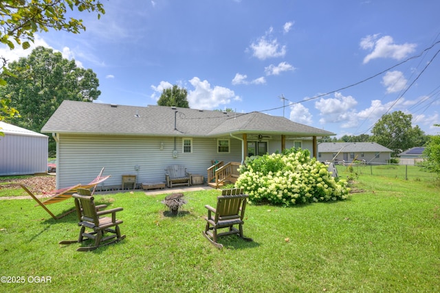 1501 Ryan Rd, Joplin, MO 64801 - back of house with a ceiling fan and a shingled roof