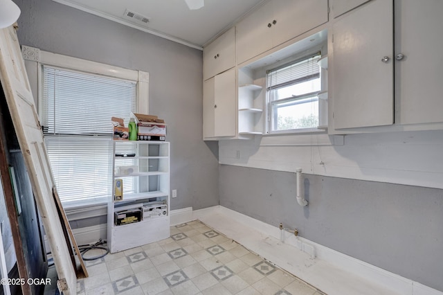 119 S Moffet Ave, Joplin, MO 64801 - kitchen with open shelves, crown molding, and white cabinetry