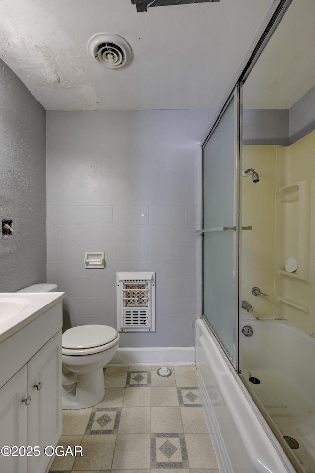 119 S Moffet Ave, Joplin, MO 64801 - bathroom featuring heating unit, vanity, and enclosed tub / shower combo