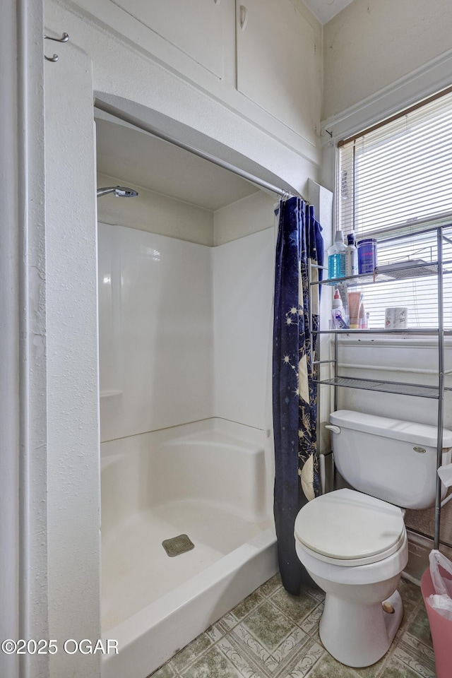 119 S Moffet Ave, Joplin, MO 64801 - bathroom featuring toilet and a shower stall