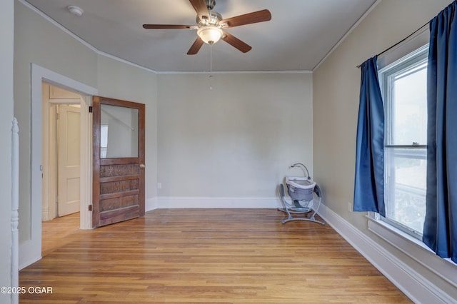 119 S Moffet Ave, Joplin, MO 64801 - empty room featuring crown molding, a smoke detector, light wood-type flooring, and a ceiling fan