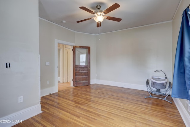 119 S Moffet Ave, Joplin, MO 64801 - spare room with crown molding, a ceiling fan, light wood finished floors, and a smoke detector