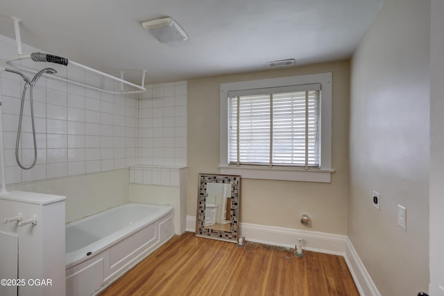 119 S Moffet Ave, Joplin, MO 64801 - bathroom with wood finished floors and tub / shower combination