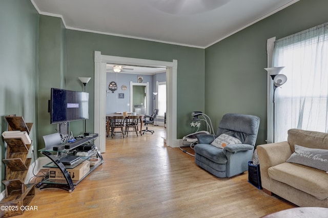 119 S Moffet Ave, Joplin, MO 64801 - living room featuring wood finished floors, ceiling fan, and ornamental molding