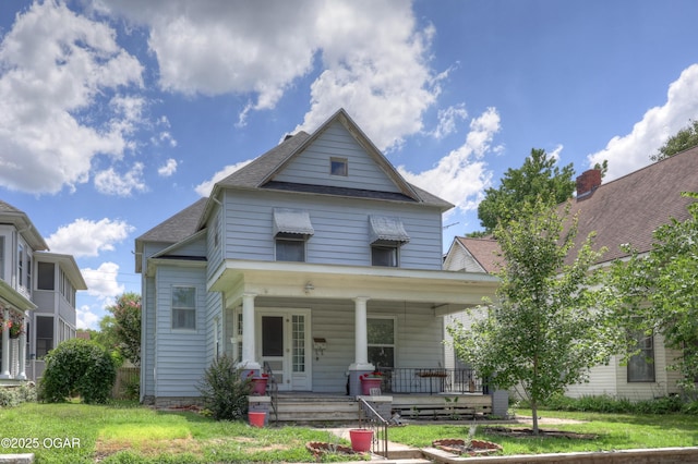 119 S Moffet Ave, Joplin, MO 64801 - view of front of house featuring a porch, a shingled roof, and a front lawn