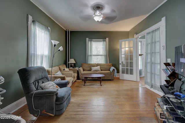 119 S Moffet Ave, Joplin, MO 64801 - living area featuring ornamental molding, wood finished floors, french doors, and a ceiling fan