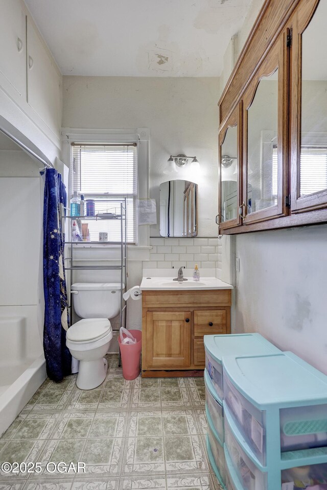 119 S Moffet Ave, Joplin, MO 64801 - bathroom featuring vanity, a shower with curtain, and backsplash