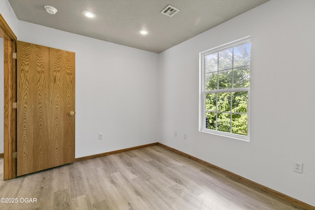 418 W Mccord St, Neosho, MO 64850 - unfurnished bedroom with light wood-type flooring and recessed lighting