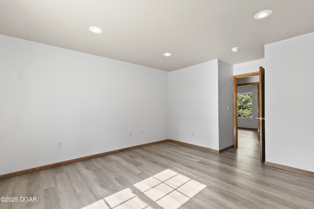 418 W Mccord St, Neosho, MO 64850 - empty room with light wood-style flooring and recessed lighting
