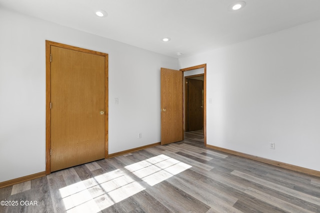 418 W Mccord St, Neosho, MO 64850 - spare room featuring wood finished floors and recessed lighting