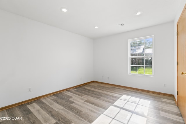 418 W Mccord St, Neosho, MO 64850 - unfurnished room with light wood-style floors and recessed lighting