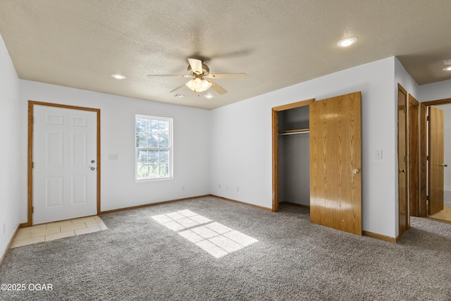 418 W Mccord St, Neosho, MO 64850 - unfurnished bedroom with carpet flooring, a textured ceiling, a closet, recessed lighting, and ceiling fan