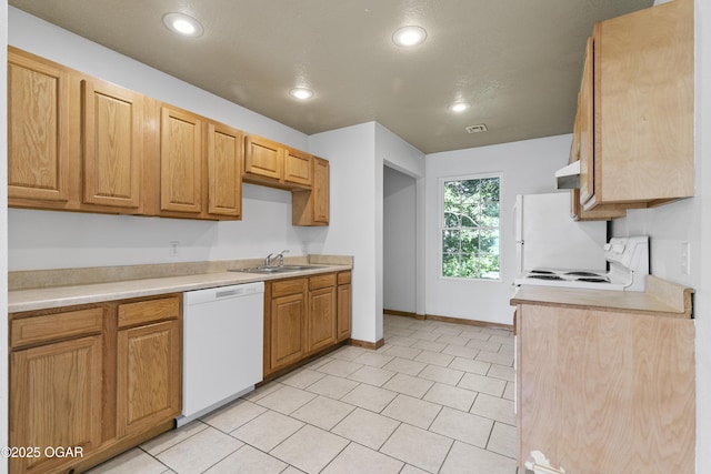 418 W Mccord St, Neosho, MO 64850 - kitchen with white appliances, recessed lighting, light countertops, and under cabinet range hood