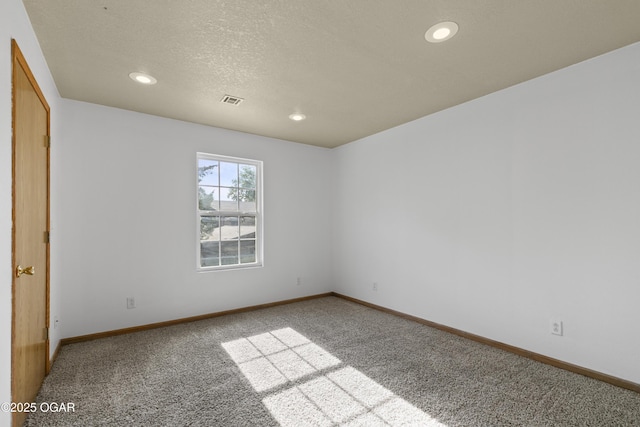 418 W Mccord St, Neosho, MO 64850 - carpeted spare room with recessed lighting and a textured ceiling