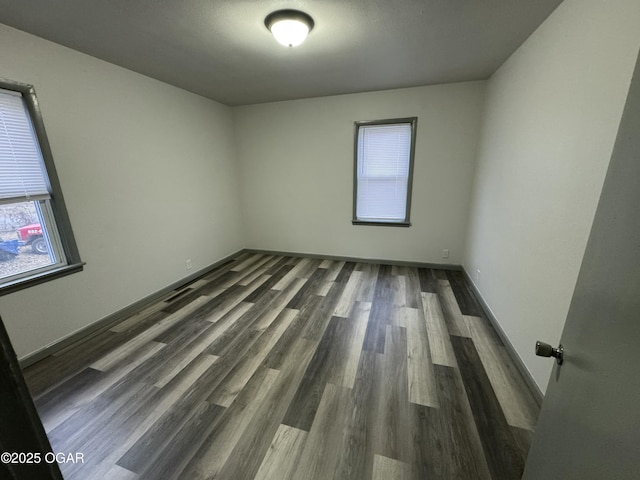 1003 Orchard St, Carthage, MO 64836 - unfurnished room with wood finished floors