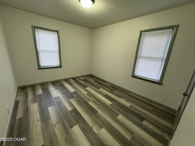1003 Orchard St, Carthage, MO 64836 - unfurnished room featuring wood finished floors
