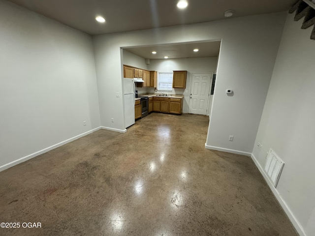 1003 Orchard St, Carthage, MO 64836 - kitchen with freestanding refrigerator, under cabinet range hood, recessed lighting, electric range, and light countertops