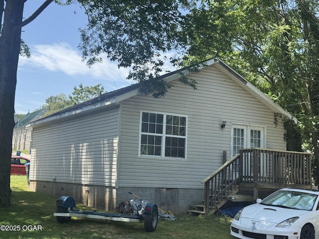 1003 Orchard St, Carthage, MO 64836 - view of side of property featuring crawl space and a lawn
