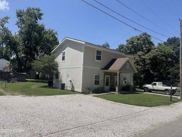 1003 Orchard St, Carthage, MO 64836 - view of front of home with a front lawn and stucco siding