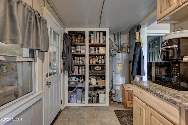 605 SE 10th Ln, Lamar, MO 64759 - storage area featuring gas water heater