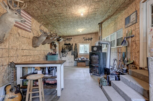 605 SE 10th Ln, Lamar, MO 64759 - interior space with lofted ceiling and a wood stove