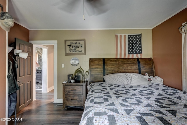 605 SE 10th Ln, Lamar, MO 64759 - bedroom featuring dark wood-type flooring, crown molding, and a ceiling fan