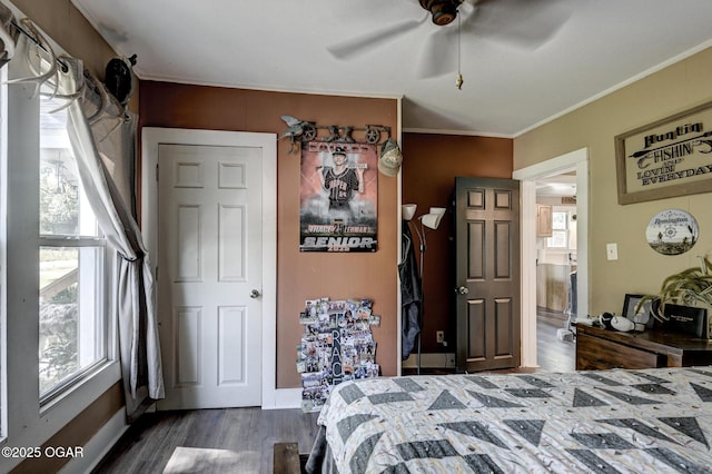 605 SE 10th Ln, Lamar, MO 64759 - bedroom featuring dark wood-style flooring, ornamental molding, and ceiling fan