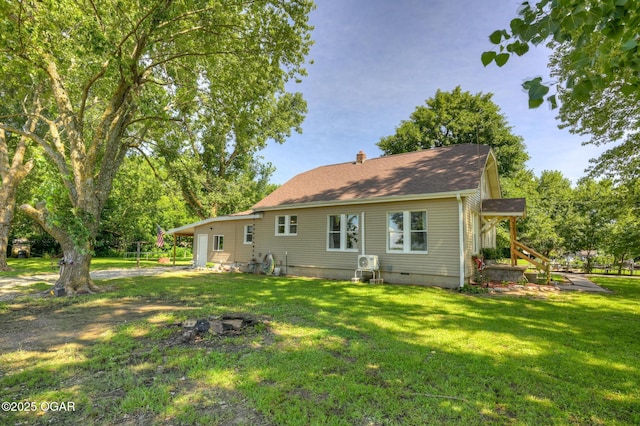 605 SE 10th Ln, Lamar, MO 64759 - back of house featuring a lawn, a chimney, and crawl space
