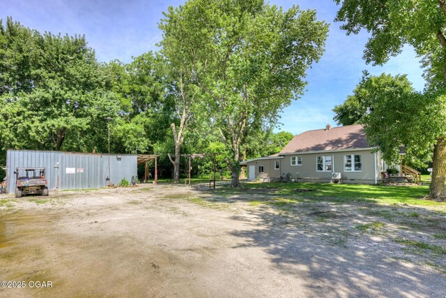 605 SE 10th Ln, Lamar, MO 64759 - view of yard featuring view of wooded area
