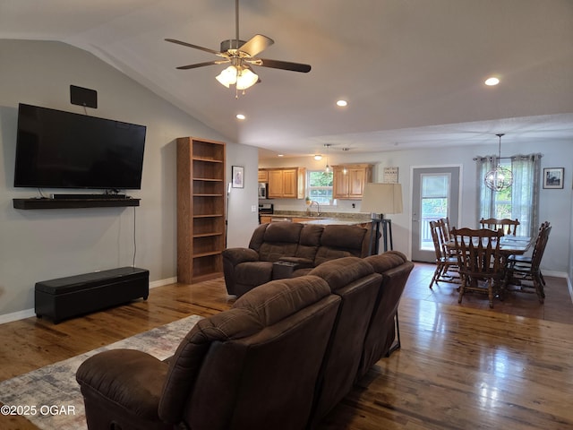 3009 S Monroe Ave, Joplin, MO 64804 - living area featuring wood finished floors, plenty of natural light, vaulted ceiling, recessed lighting, and a ceiling fan