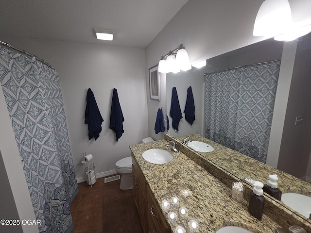 3009 S Monroe Ave, Joplin, MO 64804 - bathroom with double vanity, tile patterned floors, and curtained shower