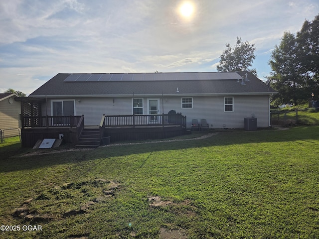 3009 S Monroe Ave, Joplin, MO 64804 - back of house featuring a deck, a shingled roof, and roof mounted solar panels