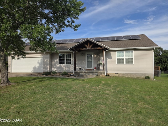 3009 S Monroe Ave, Joplin, MO 64804 - view of front of home with an attached garage, a front yard, solar panels, and driveway