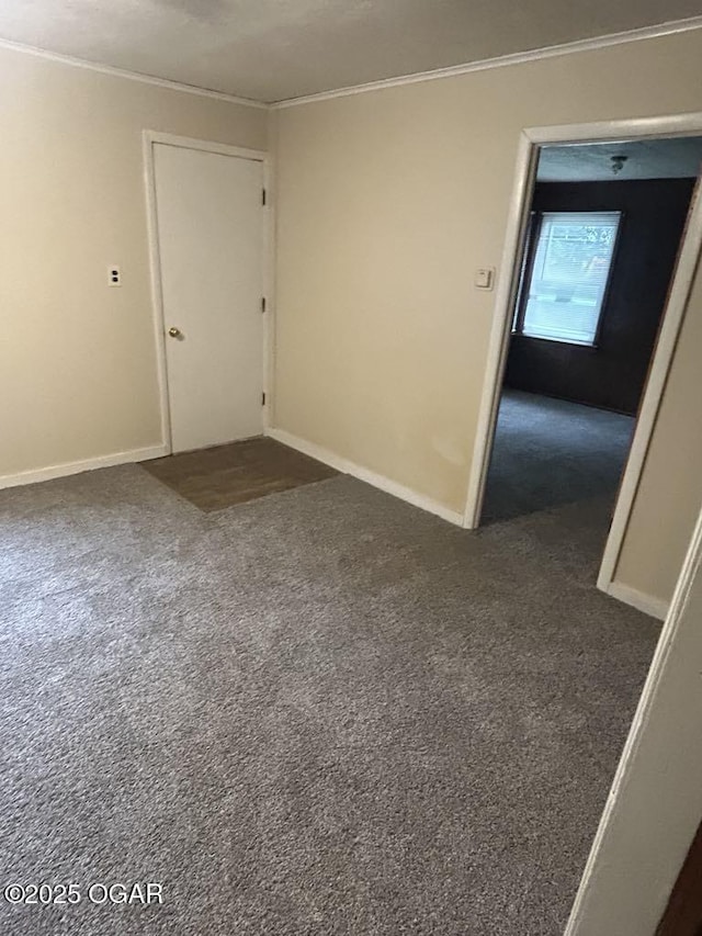 419 Depot St, Oswego, KS 67356 - empty room featuring ornamental molding and dark colored carpet