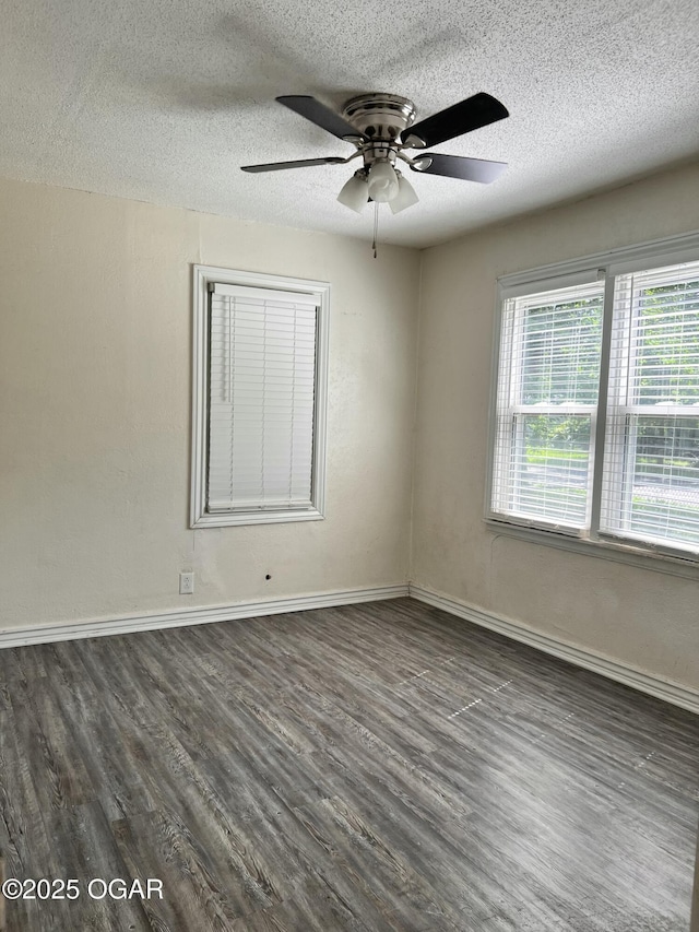821 New Hampshire Ave, Joplin, MO 64801 - unfurnished room with a textured ceiling, dark wood-style floors, and a ceiling fan