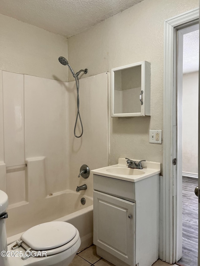 821 New Hampshire Ave, Joplin, MO 64801 - full bathroom with a textured ceiling, vanity, washtub / shower combination, and a textured wall
