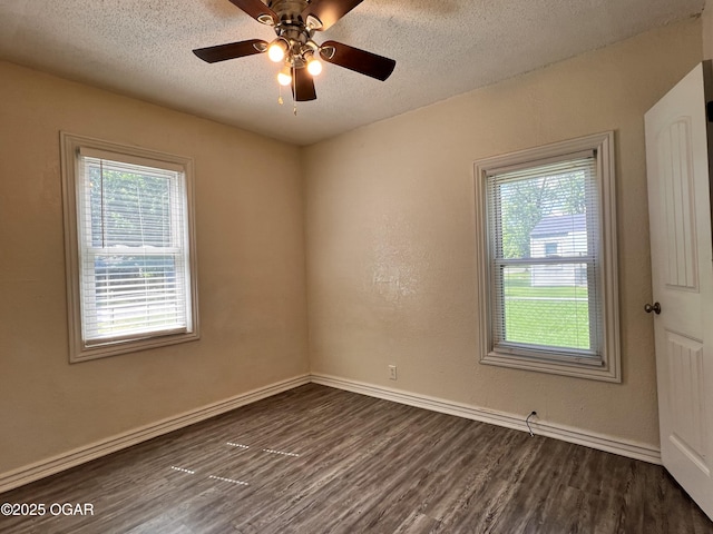 821 New Hampshire Ave, Joplin, MO 64801 - unfurnished room with dark wood-style flooring, a textured ceiling, and ceiling fan