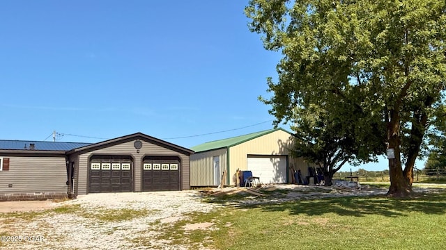 4950 SE 118th St, Galena, KS 66739 - view of front of home with an outdoor structure and a front lawn