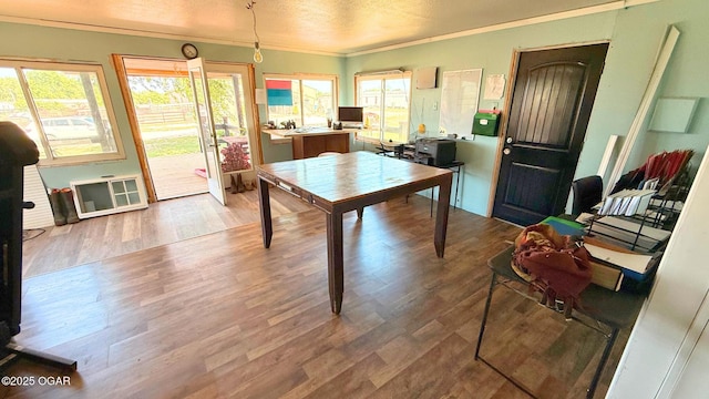 4950 SE 118th St, Galena, KS 66739 - dining area with crown molding, wood finished floors, and a textured ceiling