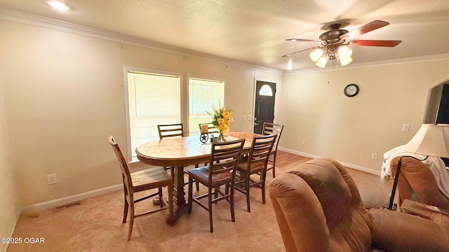 4950 SE 118th St, Galena, KS 66739 - dining area with a ceiling fan, crown molding, and light colored carpet