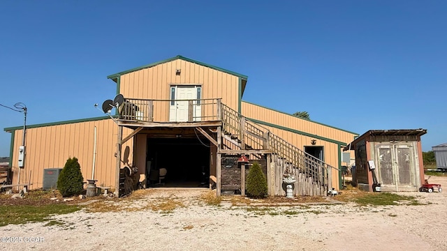 4950 SE 118th St, Galena, KS 66739 - view of front of home featuring a storage shed and stairway