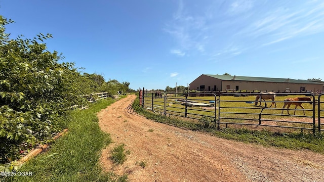 4950 SE 118th St, Galena, KS 66739 - view of dirt / gravel driveway featuring a rural view and a gated entry