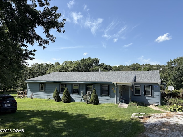 8305A Ivory Rd, Reeds, MO 64859 - view of front facade with a front lawn and a shingled roof
