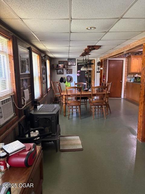 8305A Ivory Rd, Reeds, MO 64859 - dining space with a paneled ceiling and a wood stove