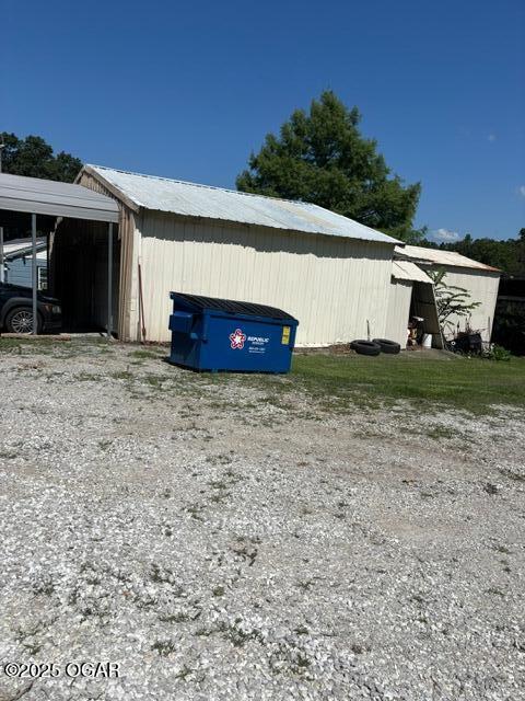8305A Ivory Rd, Reeds, MO 64859 - view of pole building featuring a garage