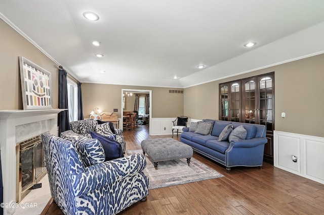 5623 Rivercrest Valley Dr, Joplin, MO 64804 - living area with a wainscoted wall, ornamental molding, hardwood / wood-style floors, recessed lighting, and a fireplace with flush hearth