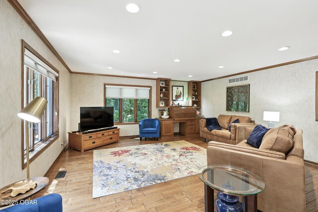 5623 Rivercrest Valley Dr, Joplin, MO 64804 - living area featuring ornamental molding, light wood finished floors, and recessed lighting