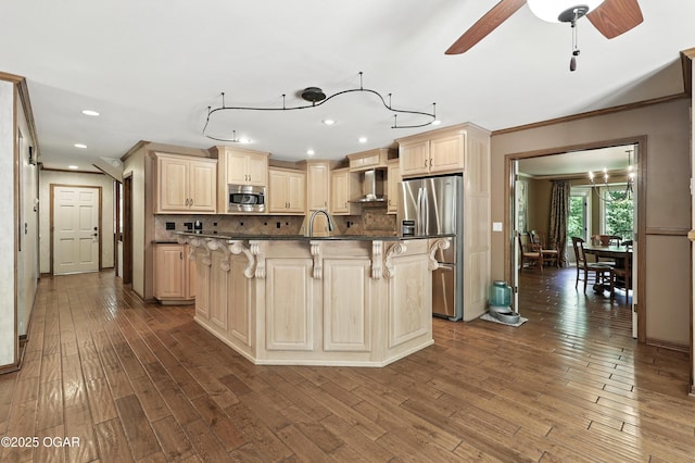 5623 Rivercrest Valley Dr, Joplin, MO 64804 - kitchen featuring appliances with stainless steel finishes, a breakfast bar, decorative backsplash, dark wood-style flooring, and crown molding