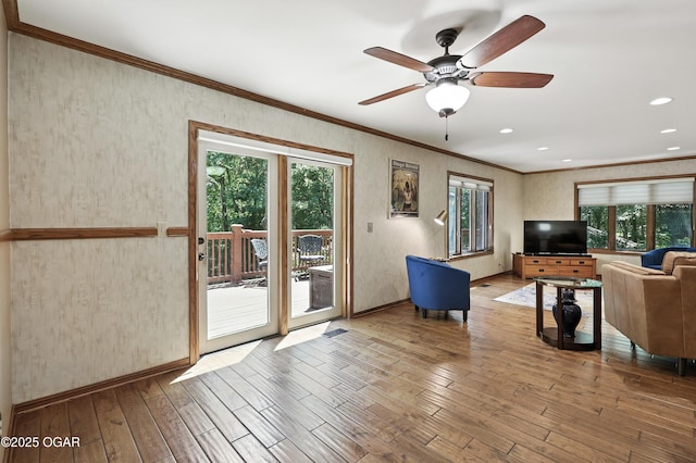 5623 Rivercrest Valley Dr, Joplin, MO 64804 - living area featuring ornamental molding, plenty of natural light, wood finished floors, ceiling fan, and recessed lighting